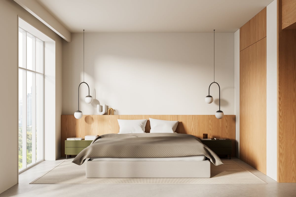 Cozy modern remodeled bedroom with soft tones and pendant lighting